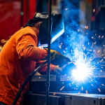 Cinematic Welder Sparks in Blue Smoke